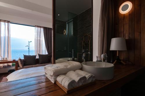 Postel nebo postele na pokoji v ubytování Manwu Dali Jimu Boutique Guesthouse