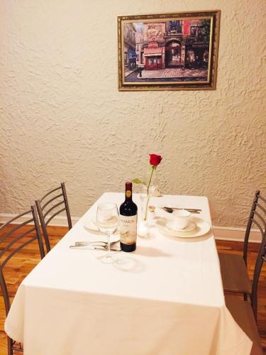 a table with a bottle of wine and a rose on it at Entire Apartment in heart of Lincoln Park & Lake Sea and beach in Chicago