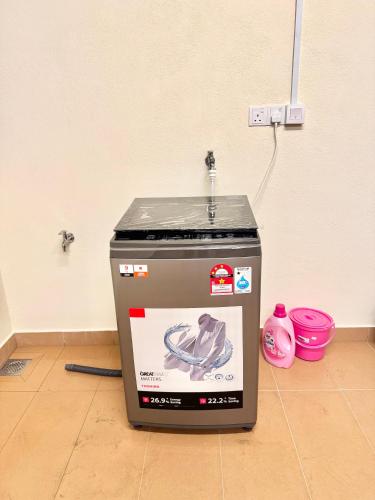 a trash can sitting on the floor in a room at Heartstay Tanjong Karang 妍菁名宿 in Kampong Tanjong Karang