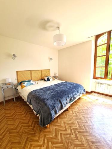 Postel nebo postele na pokoji v ubytování Moulin du château
