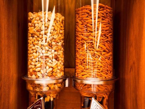 a group of jars filled with peanuts at HOTEL RELIEF Kokura Station in Kitakyushu