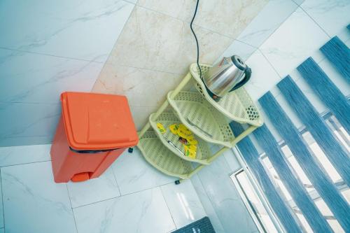 an overhead view of some food in baskets on a floor at Sweet Homes in Dodoma