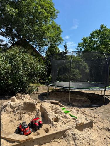 a sand castle in front of a hoop at Amber Coast domek nr 2 in Jantar