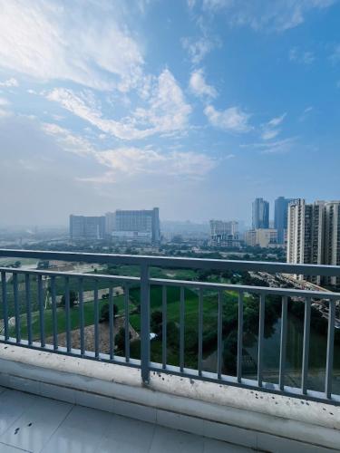 a view of a city from a balcony at Cozy Studio by HoodSquare- NXone, 15 mins from Central Noida in Jāmb