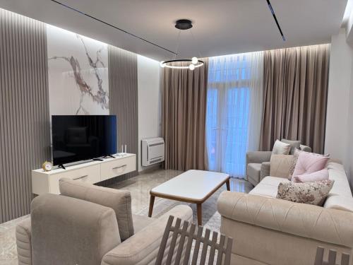 TV a/nebo společenská místnost v ubytování Roes Appartment 1