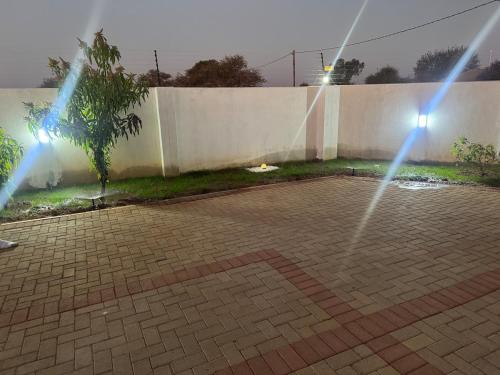 a couple of lights on a brick patio at Bihira AirB&B in Gaborone