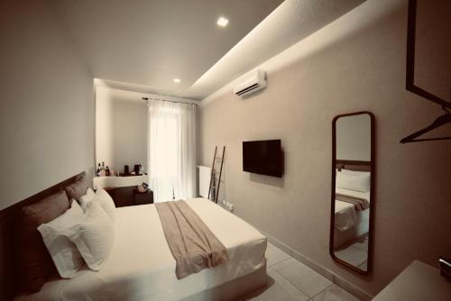 Кровать или кровати в номере Exclusive Rooms at Boutique Arte