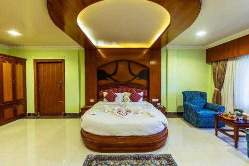 Ένα ή περισσότερα κρεβάτια σε δωμάτιο στο Hotel Earth Light, Chitwan National Park