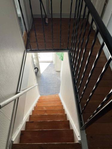 a staircase in a building with wooden steps at Gravsgade 55 in Ribe