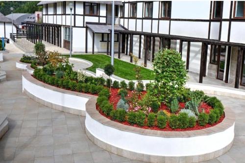 a garden in the middle of a building at Apartment Aleksandar AS in Brzeće