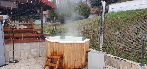 a bath tub with steam spraying out in a garden at Комплекс Асеневци in Tsareva Livada