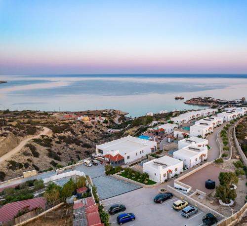 an aerial view of a town next to the ocean at SOPHID Wellness Suites Karpathos in Karpathos Town