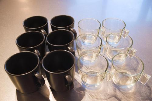 a group of cups and wine glasses on a table at HK House in Ichinomiya
