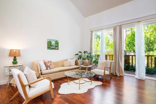 a living room with a couch and a table at Folsom 4BR Retreat - Backyard & Parking in Folsom
