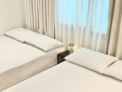 Кровать или кровати в номере Malang Home