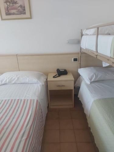 Ένα ή περισσότερα κρεβάτια σε δωμάτιο στο Hotel Holiday Garnì