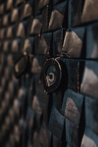 a close up of a wall made up of tiles at Boutique Hotel Stella Maris in Maastricht