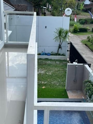 a view of a house with a yard withgrass at D'illy Borobudur Villa in Magelang