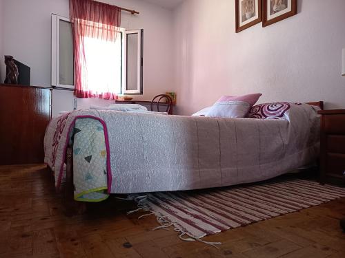 a large bed sitting in a room with at Casa do Ruben Lisboa in Lisbon