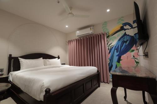 Ένα ή περισσότερα κρεβάτια σε δωμάτιο στο Hotel Nirvana boutique