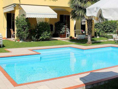a swimming pool in front of a house at Holiday Home in Lazise near Lake Garda in Lazise