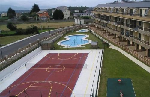 an overhead view of a tennis court on a building at Costa SPA Superior de lujo - Playa de las Catedrales in San Miguel de Reinante
