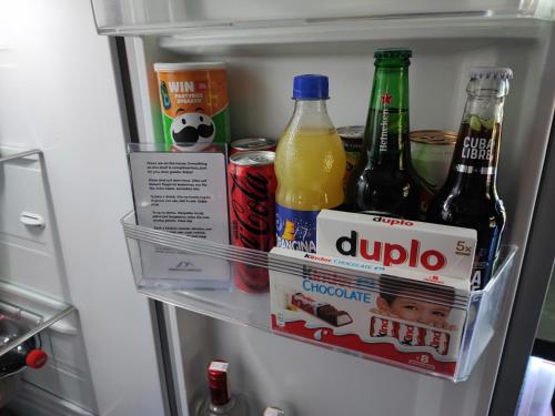 an open refrigerator filled with drinks and sodas at ZAGORA HILLS Premium Apartman SELF CHECK-IN, FREE PARKING in Krapina