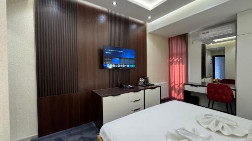 Телевизор и/или развлекательный центр в Energy hotel Tashkent
