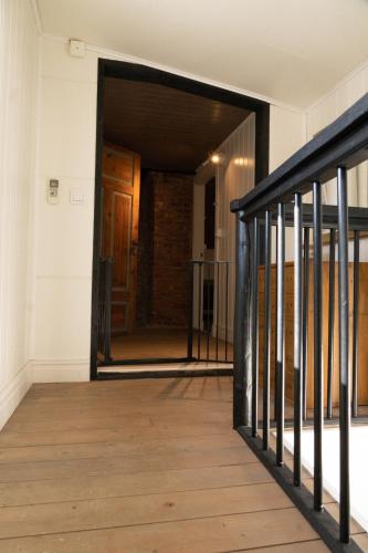 an open door to a hallway in a building at Cozy white house close to the nature with Wi-Fi 