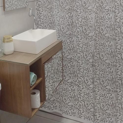 a bathroom with a sink and a wall mural at Guest House in Petrópolis in Petrópolis