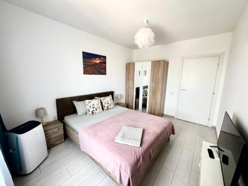 Katil atau katil-katil dalam bilik di QUOVADIS Apartament
