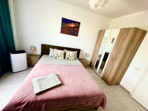 Katil atau katil-katil dalam bilik di QUOVADIS Apartament