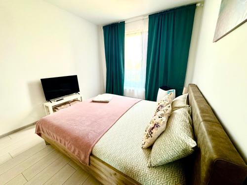 Katil atau katil-katil dalam bilik di QUOVADIS Apartament