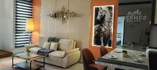 a living room with a couch and a table at Bali Melaka SeaView WaterPark 2-5Pax 5minJonker Projector in Melaka