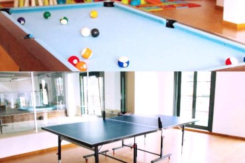 a pool table with balls on top of it at Costa SPA Superior de lujo - Playa de las Catedrales in San Miguel de Reinante