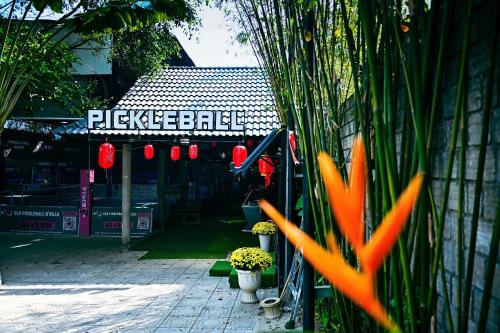 a building with a sign that says pickle ball at D'Villa Hotel - Homestay in Kon Tum