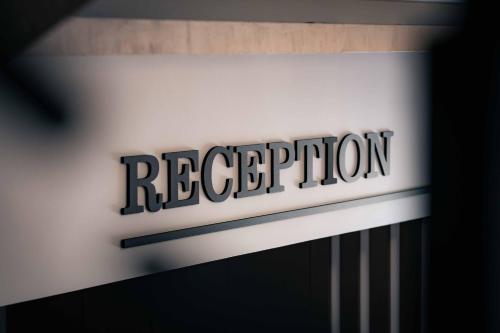 a sign for a rec department store is pictured at a store at Royal View Guest House in Dospat