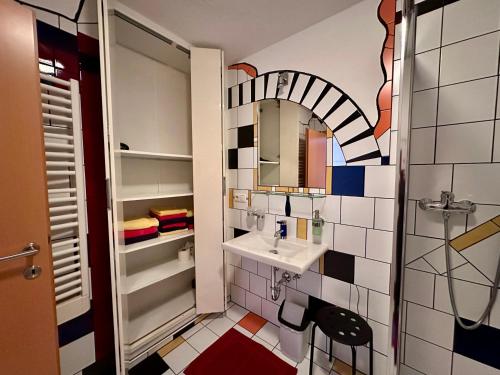a bathroom with a sink and a mirror at Apart Annelies in Kauns