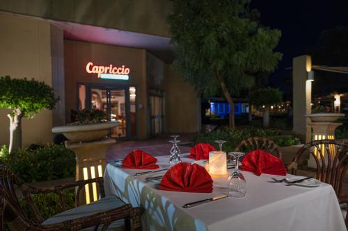 a table with red napkins and napkins at Jolie Ville Hotel & Spa Kings Island Luxor in Luxor