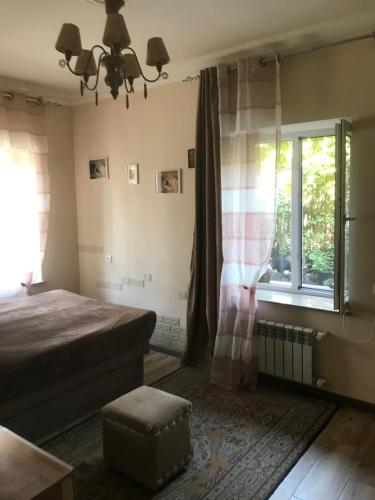 Ένα ή περισσότερα κρεβάτια σε δωμάτιο στο Maison familiale très confortable à Erevan, Arménie