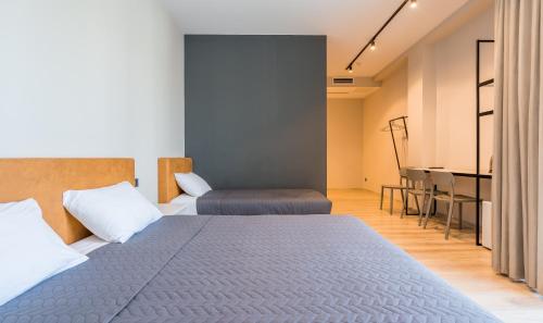 a bedroom with a bed and a piano in a room at Doors Boutique Hotel in Tbilisi City