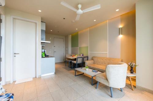 a living room with a couch and a table at The Trot Hotel & Suites near Yashobhoomi Udyog vihar in Gurgaon