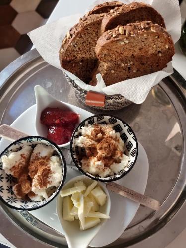 a tray of food with a loaf of bread and other foods at BnB Bagno di Bosco in Gubbio