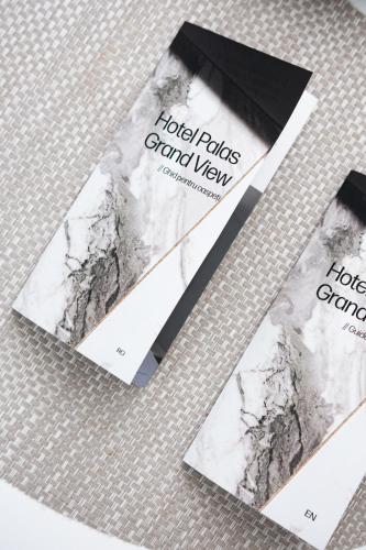 a couple of cards with a marble pattern on them at Hotel Palas Grand View in Iaşi