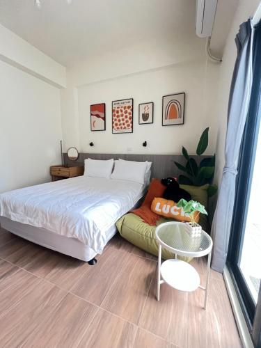 Una cama o camas en una habitación de Manman Homestay