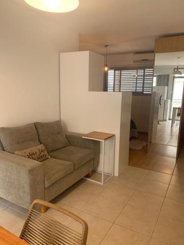 a living room with a couch and a table at Departamento céntrico in Rosario