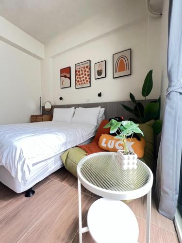 Una cama o camas en una habitación de Manman Homestay