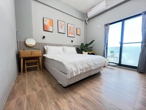 Una cama o camas en una habitación de Manman Homestay