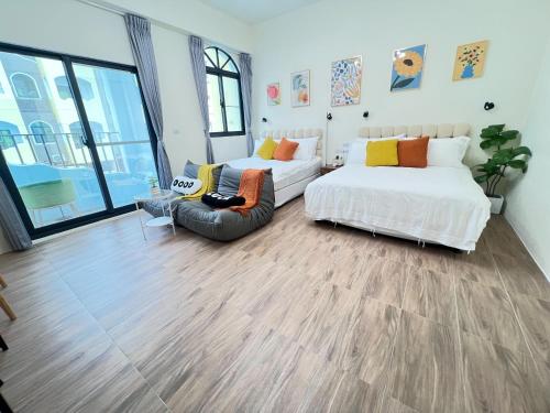 Una cama o camas en una habitación de Manman Homestay