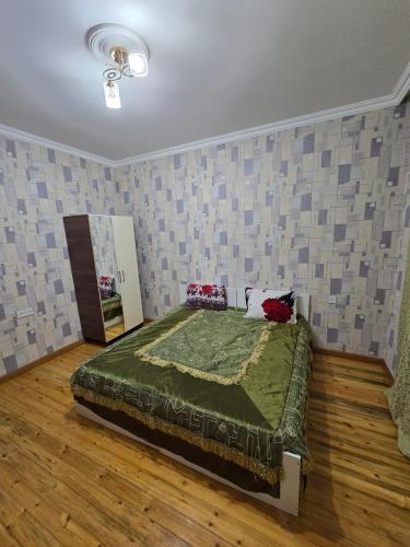 a bedroom with a large bed in a room at Julian Guest House in Cülyan